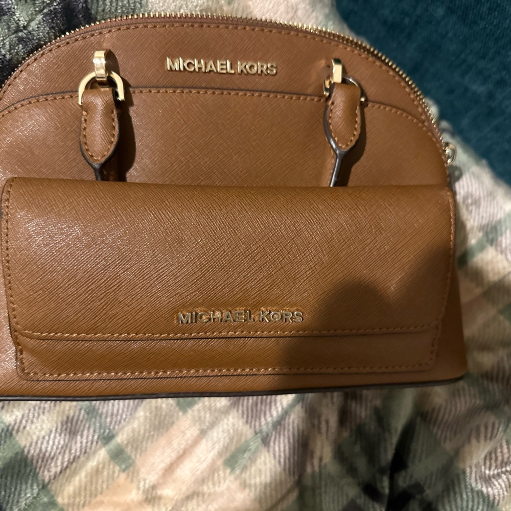 Super cute small brown bag with matching wallet.